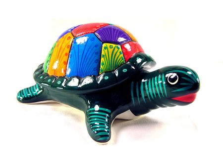 Colorful ceramic turtle on a white background.の写真素材