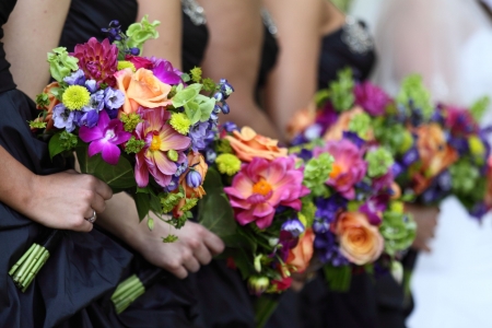 Bride and bridesmaids holding their flowersの写真素材
