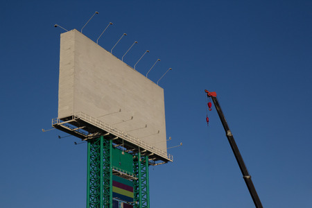 Maintenance service crane and clear billboardの写真素材