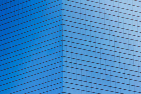 blue glass building with light reflectionの写真素材