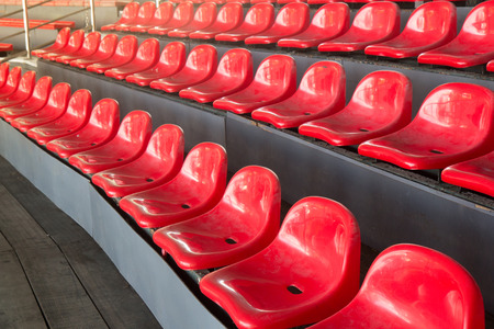 red plastic chairs of old sport stadium