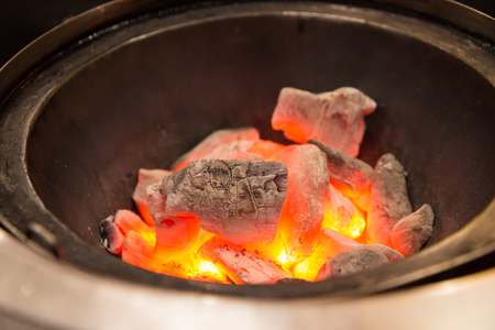 hot coal stove in grill restaurantの写真素材