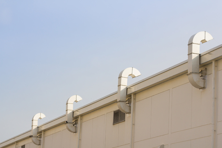 air ducts outside factory buildingの写真素材