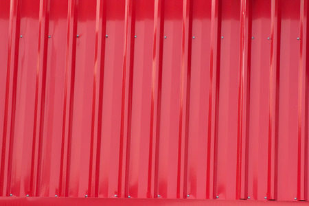red corrugated panel, part of factory roof, red metal backgroundの写真素材