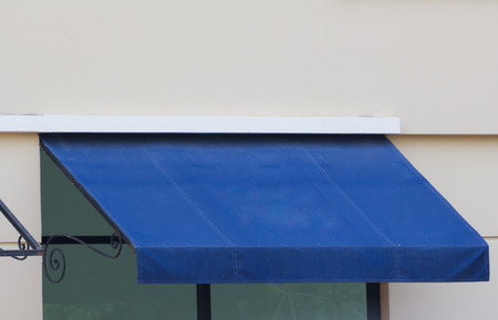 blue awning over glass window