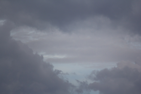 dark cloudy sky background in rainy season, weather forecastの写真素材