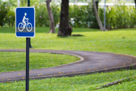 bicycle sign on steel pole in public park