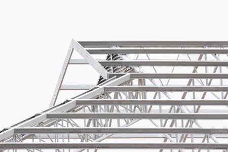 grey steel structure of roof, unfinished roof on white backgroundの写真素材