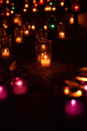 Candles in the cemetery. Selective focus, shallow depth of field.の写真素材