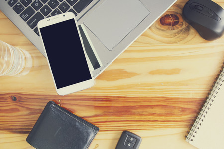 Smartphone mock up template on office deck. View from aboveの写真素材