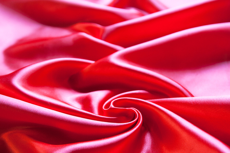 Smooth elegant red silk or satin can use as backgroundの写真素材
