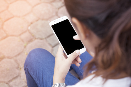 mobility and modern lifestyle concept: young woman at the park.の写真素材