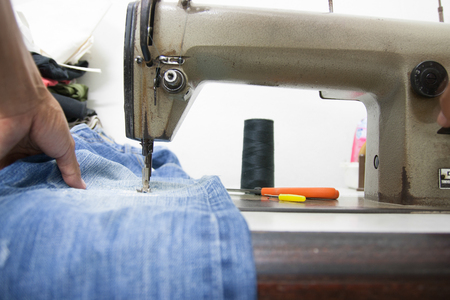 Sewing Process - Women's hands behind her sewingの写真素材