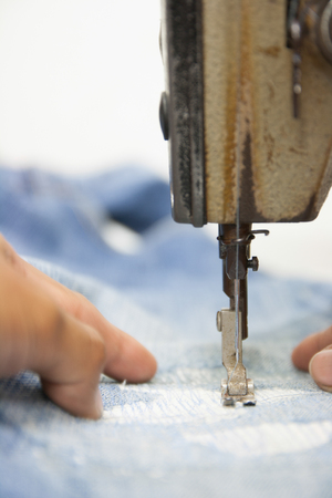 Sewing Process - Women's hands behind her sewingの写真素材