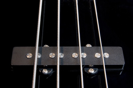 black clear jazz rock bass guitar pickup with strained stringsの写真素材