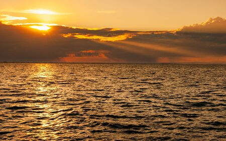 Evening sunset landscape on the Black Sea, thunderclouds in the distance.の写真素材