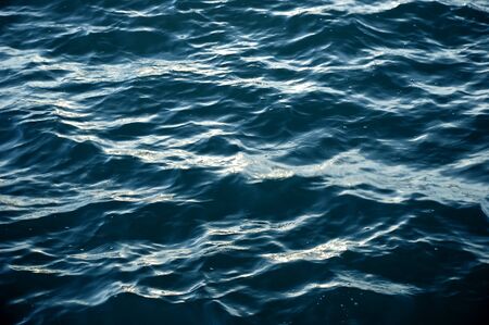 Beautiful blue sea wave close up, low angle viewの写真素材
