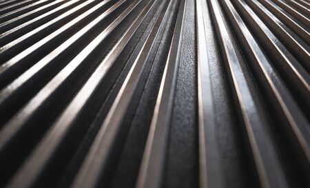 Close-up of a golden corrugated metal surface