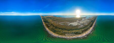 Three hundred and sixty degrees panorama of the blue sea and sunny sky of the coastal area on a hot summer sunny day. Environmentally friendly planet conceptの写真素材