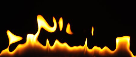Calm little flame without smoke on a dark background