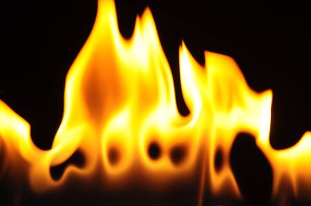 Calm little flame without smoke on a dark background