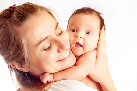 Close-up a caring young mother wipes girl