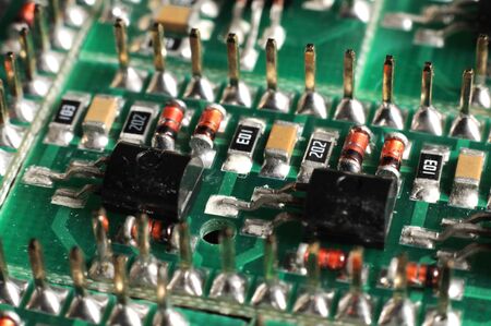 Close-up side view of a panel of SMD is located on the production of automatic control systems. The concept of industrial production of equipment for industrial and strategic purposesの写真素材