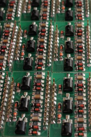 Close-up side view of a panel of SMD is located on the production of automatic control systems. The...