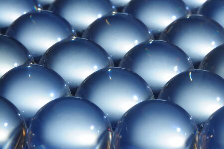 Close-up large shiny glass balls lie next to each other. Abstract parts concept. Decor and design concept. Copyspaceの写真素材