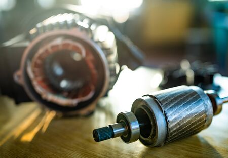 Close-up of a disassembled part from a automotive system lies on a table in the manufacture of automotive parts. The concept of inventors and new technologiesの写真素材