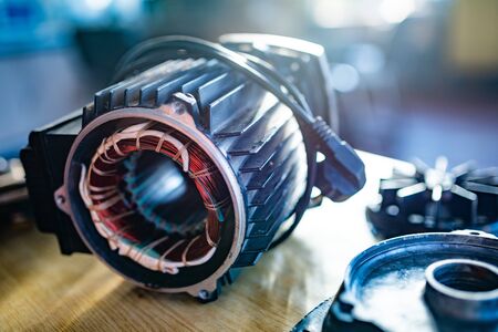 Close-up of an unidentified part with a thick bundle of copper wire for the production of air transport in the production of military equipment. The concept of modern military technologyの写真素材