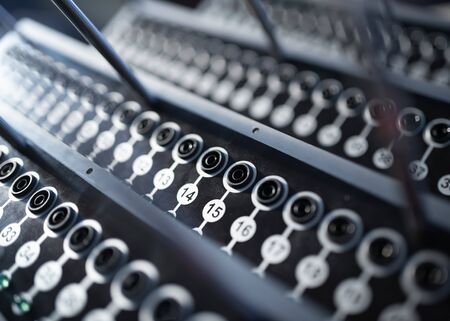 Close-up side view of sophisticated radio-controlled equipment with numbered panels and buttons located at a secret military base. Secret Technology Conceptの写真素材