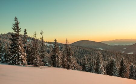 Fascinating picturesque landscape of the slope covered with forest thickets against the backdrop of...