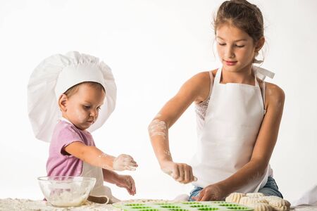 Little and cute kids brother and sister cook