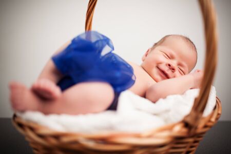 Cute baby with bow taking nap.の写真素材