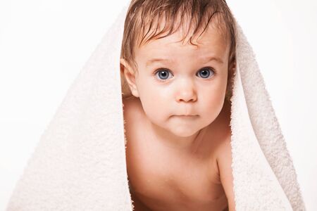 Cute baby with towel on head.の写真素材