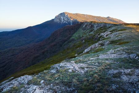 Picturesque mountain panorama the top of the hills and mountains nice undersized grass on a sunny...