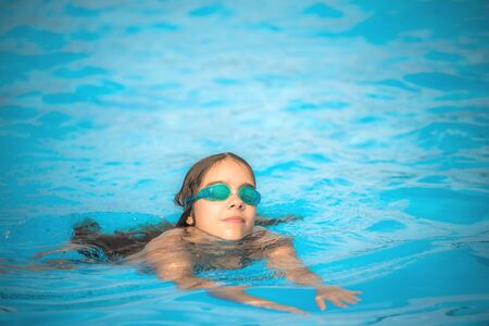 Charming girl teenager wearing waterproof glasses