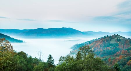 View of picturesque mountain valley with blue sky on background. Magnificent highlands with colorful...