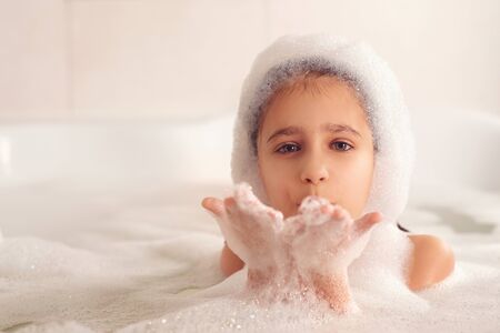 Games with white and fluffy foamの写真素材