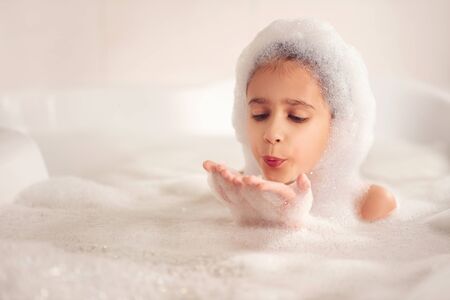 Games with white and fluffy foamの写真素材