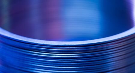 Close-up blue flat steel twisted strip in the production of designer unique things and furniture. Concept of large iron parts. Advertising spaceの写真素材