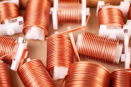 Close-up a lot of twisted flat copper wires worn on plastic corks in anticipation of further production powerful high-frequency transceiverの写真素材