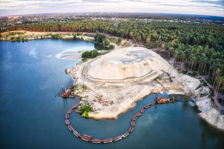 The station for the extraction and cleaning of sand stands about and in the lake