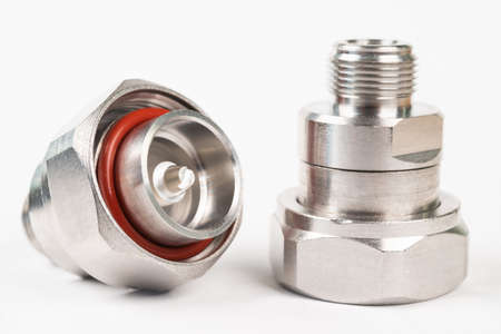 Microwave coaxial adapter 7 16 DIN Male To N Female connector. Concept of radio details. High...