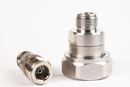 Microwave coaxial adapter 7 16 DIN Male To N Female connector. Concept of radio details. High...