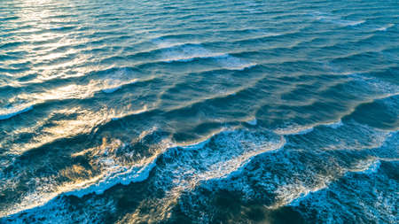 Aerial view waves on sand beach. Sea waves on the beautiful beach aerial view drone 4k shot.
