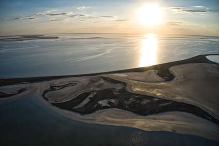 Unusual islands on a brilliant lake and colorful sunsetの写真素材