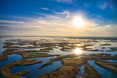 Irresistible floods on the Samara River on the Dnieper in Ukraine in the evening warm bright light. Aerial panoramic drone shotの写真素材