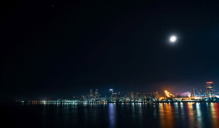 Big Dnieper river in the huge night bright city of Dnipropetrovsk in Ukraine